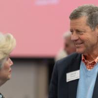 Two event guests in conversation